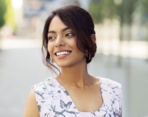 portrait of happy smiling indian woman outdoors