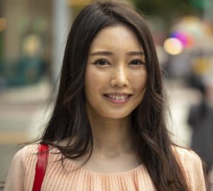 Asian woman in city smile happy face portrait