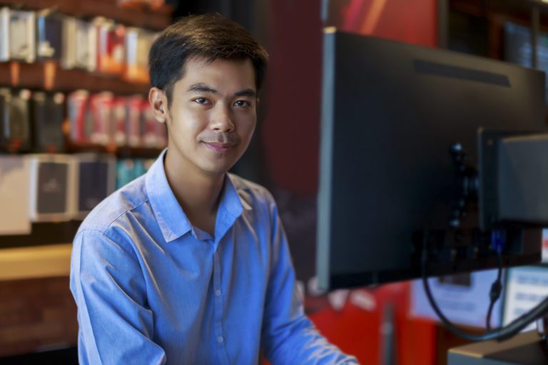 asian businessman looking at camera