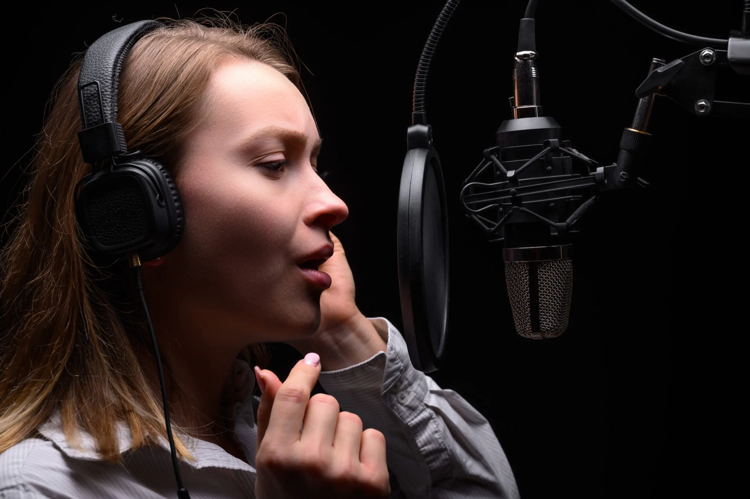 Radio presenter working on the radio, with dramatic light.